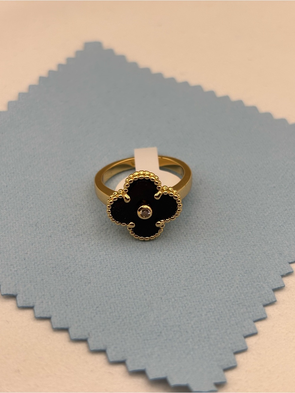 Gold Ring with Black Clover Motif and Center Stone